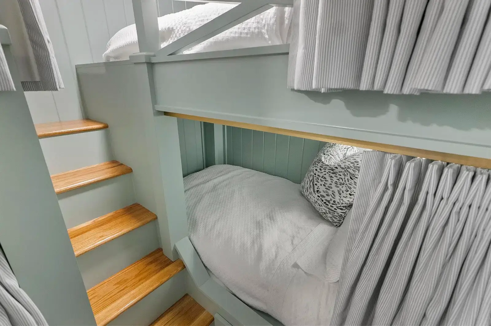 A wider view of the bunk bed setup in the bedroom.