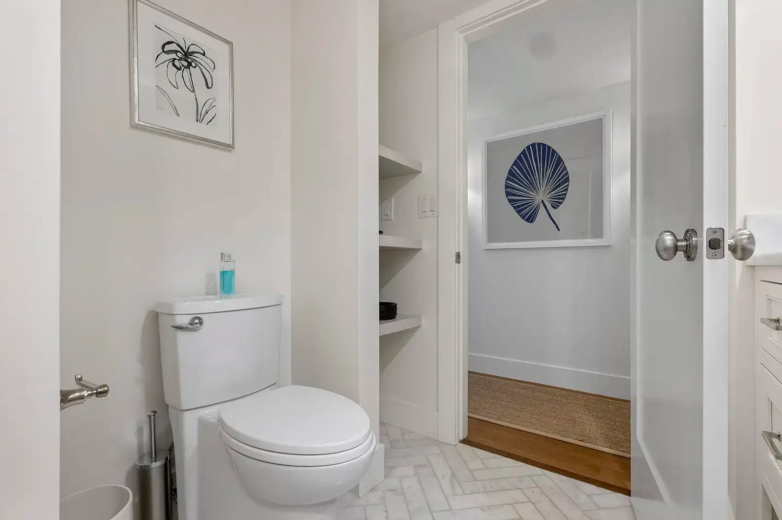 Built-in shelves providing functional storage in the bathroom.