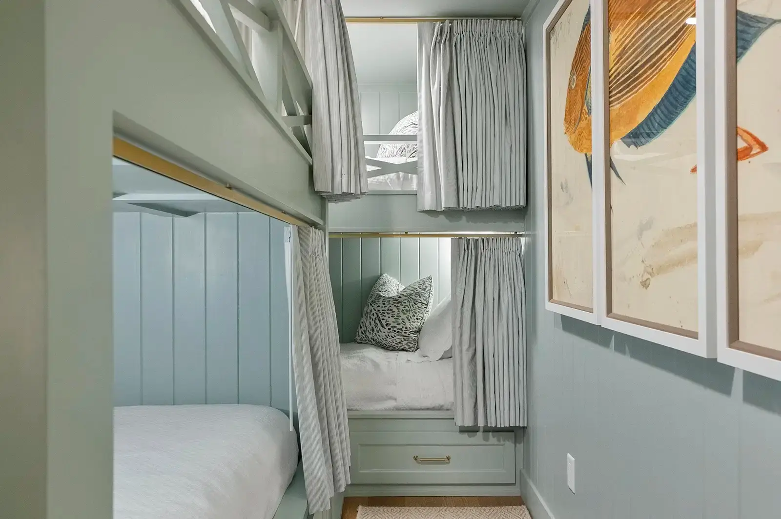 Custom-built bunk beds maximizing space in the bedroom.