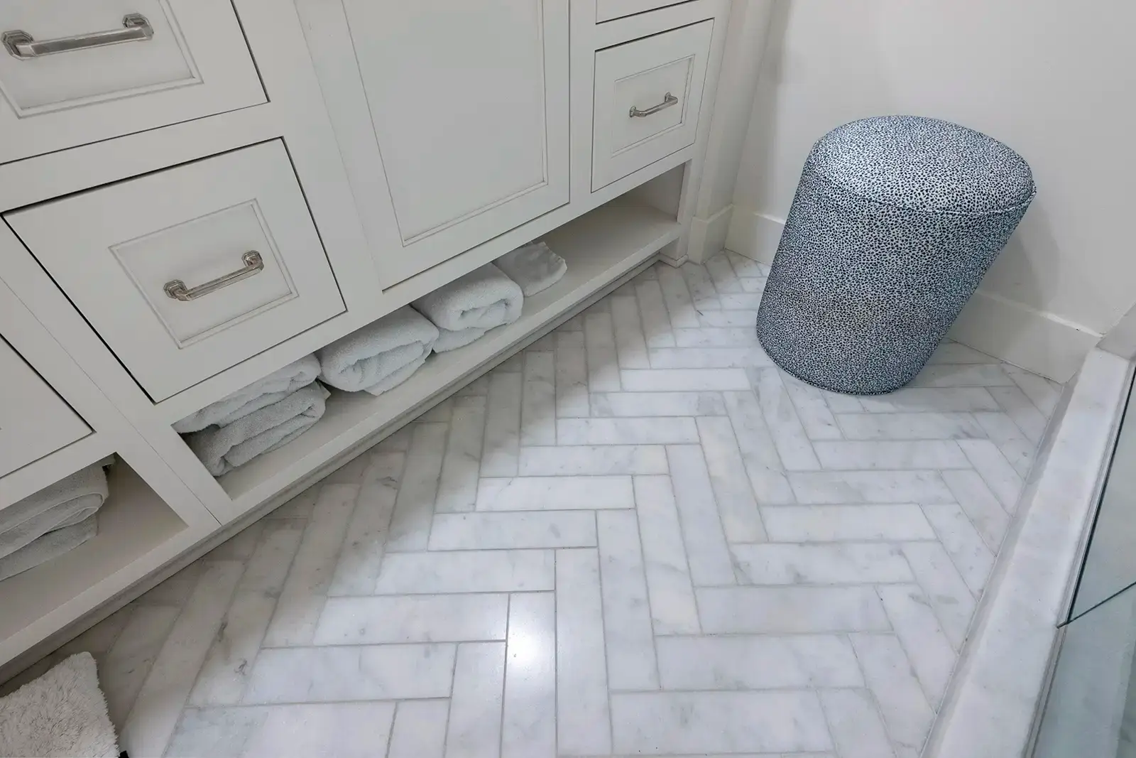 Intricate herringbone tile design adding a touch of sophistication.