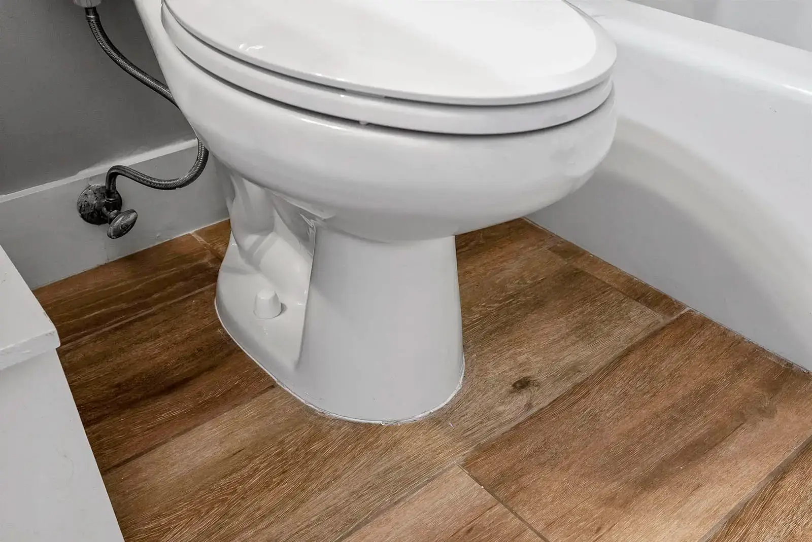 New flooring adds a fresh look to the bathroom in this Ponce Inlet condo renovation.