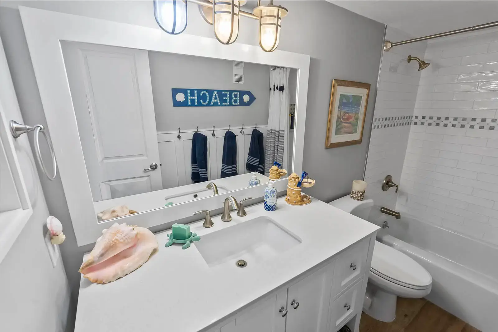 Modern fixtures and finishes define this bathroom renovation in a Ponce Inlet condo