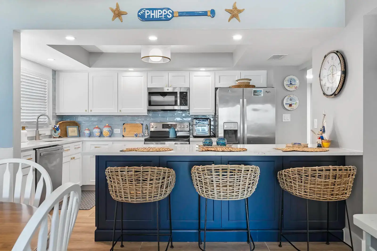 Tailored cabinetry provides ample storage and a clean aesthetic in this Ponce Inlet condo kitchen remodel.