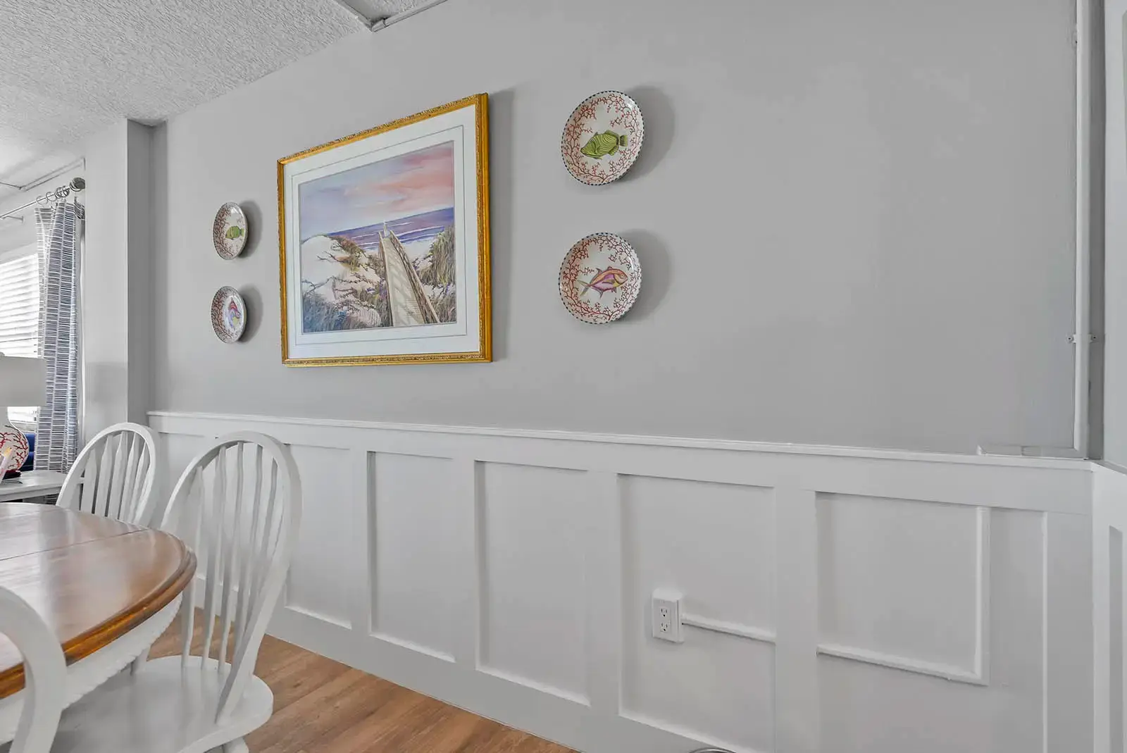 Classic wainscoting adds character and charm to this renovated condo in Ponce Inlet, Florida.