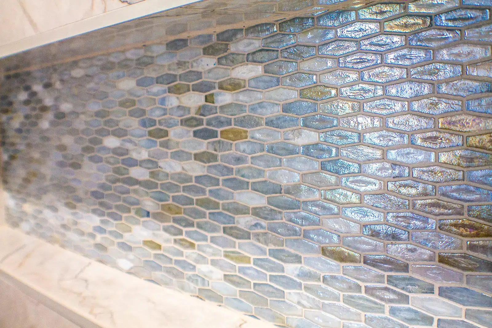 Close-up of shower shelf and accent tiles